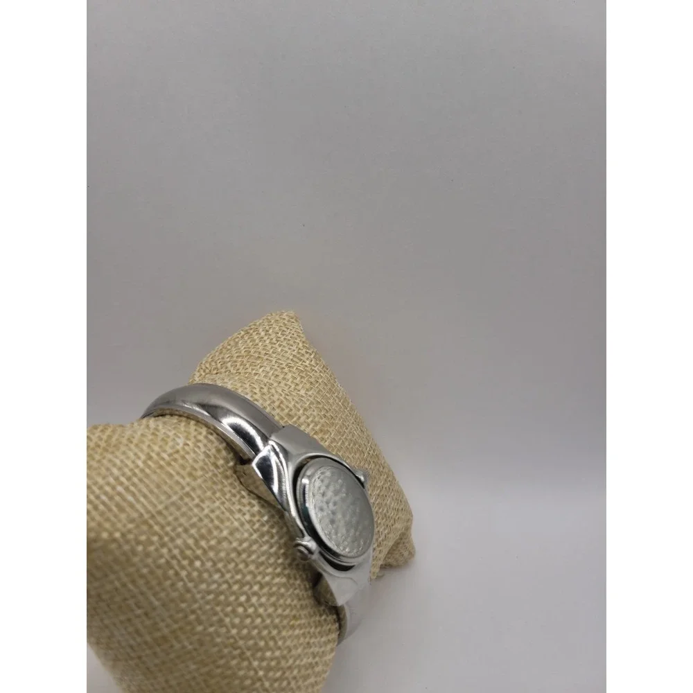 Xanadu Women's Silver Tone Hinged Cuff Bangle Quartz Watch Oval Dial Reverse